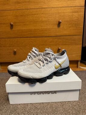 Nike Women’s VaporMax Flyknit Sneaker - Light Gray with Gold Swoosh